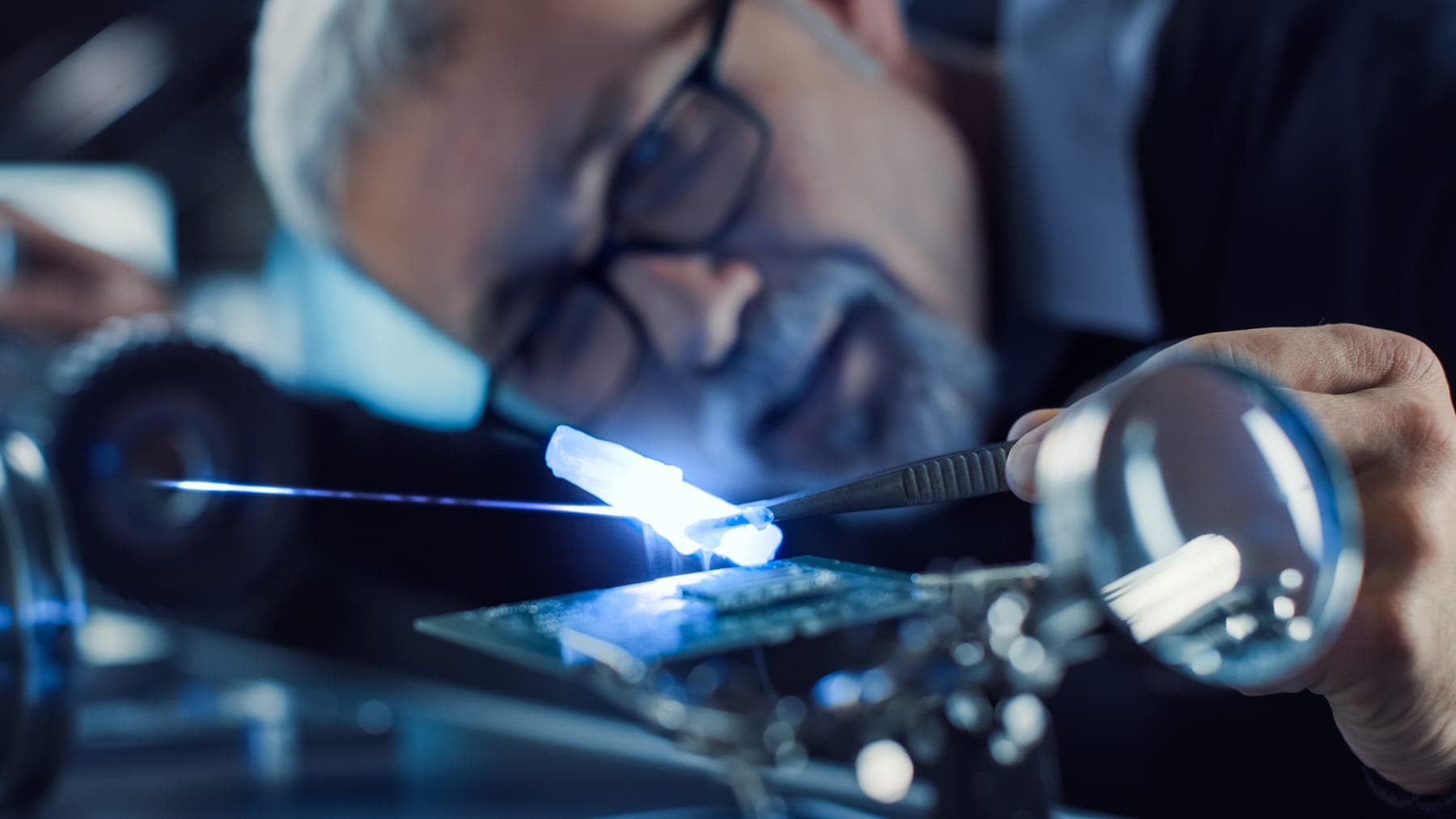 A precision optical assembly under inspection lighting